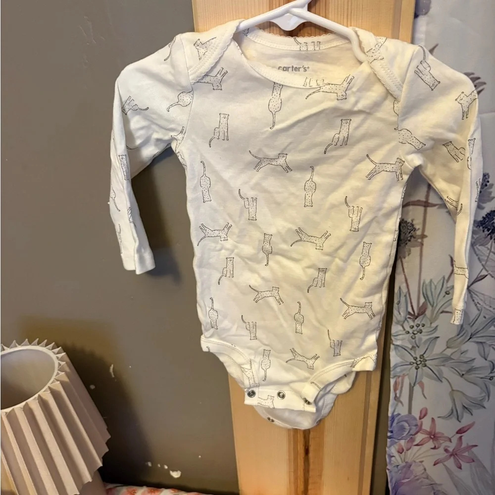 Carter's Cream Bodysuit with Animal Design.  5 size 9 months onesies for $15